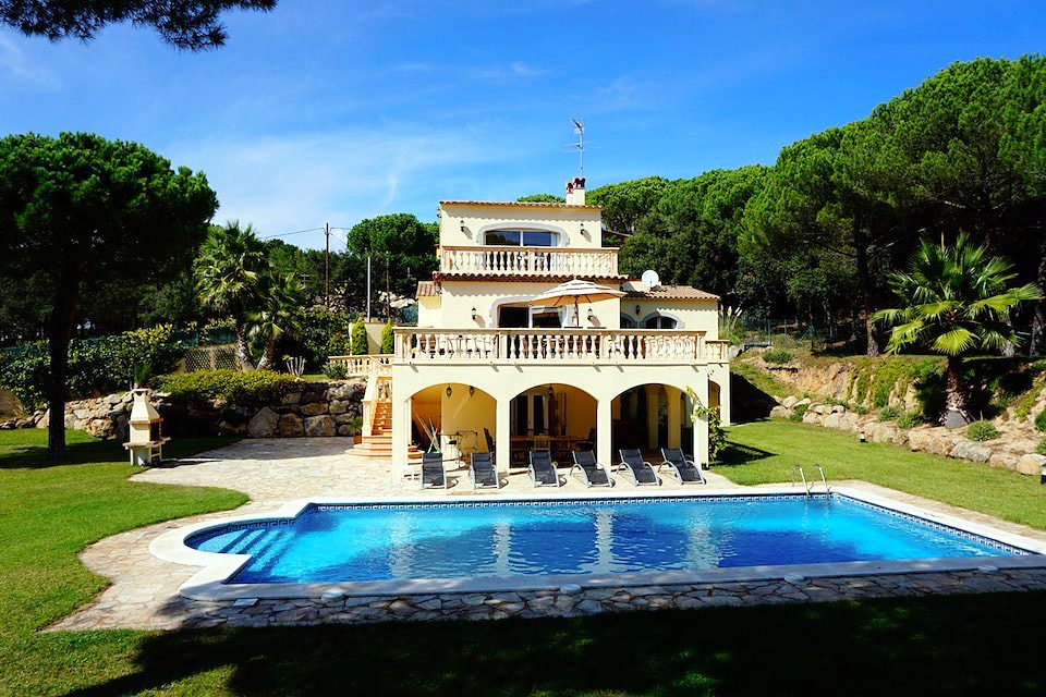 A hillside villa with a twelve-metre pool and lawns for children to run on.